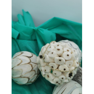 Chaine de cheville en acier inoxydable doré avec des trèfles.
